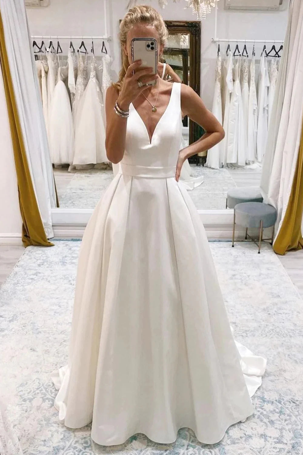 Best wedding dresses for traditional weddingsIvory A-Line Deep V-Neck Long Wedding Dress with Bowknot Sleek Wedding Dress